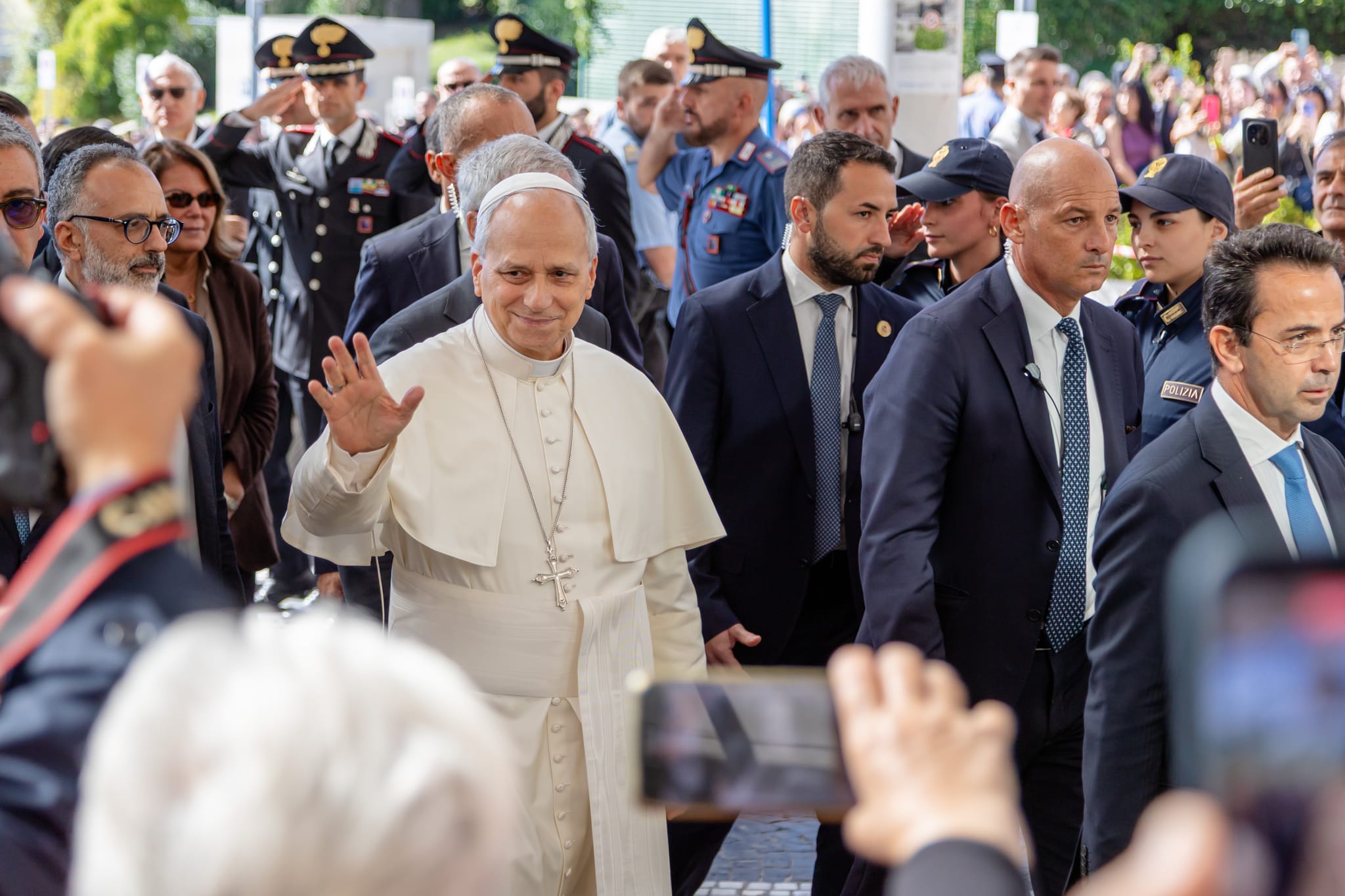 Pope Leo waves at people gathered at Gemelli Hospital as he enters to undergo surgery Oct. 13 (Credit: Zeale News)